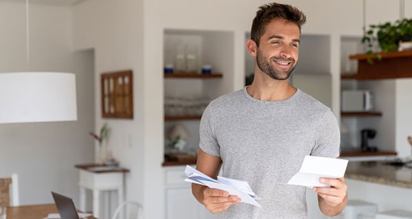 Man Holding Paper Bills